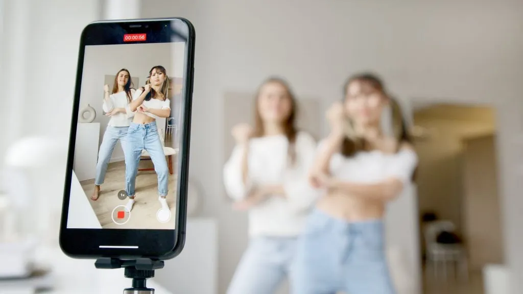 A creator filming an Instagram Reel on a phone